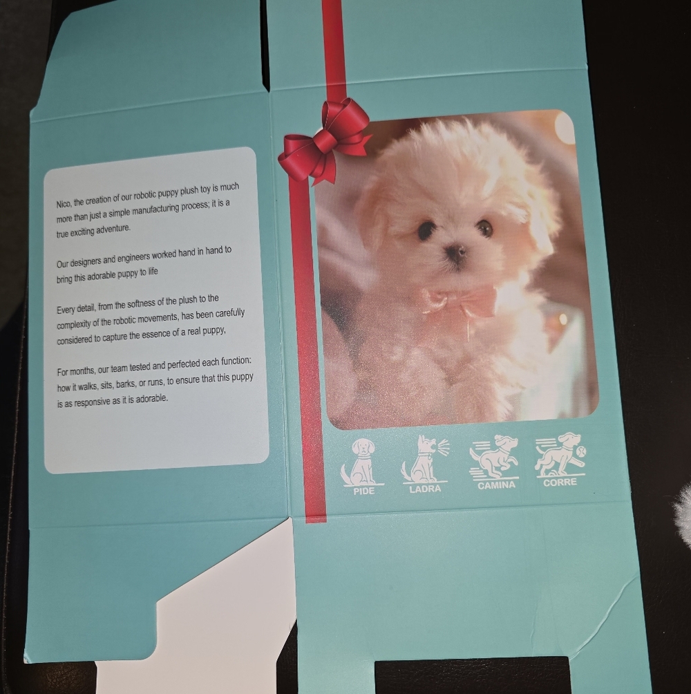 Interactive Puppy Toy with Red Bow.  Looks Like A Maltese With a puppy Cut